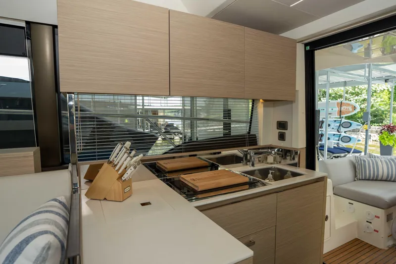 Slide: The Image of Modern kitchen interior on 2025 Pacific Prestige 460 Fly yacht, featuring sleek cabinetry and dual sinks. - 52