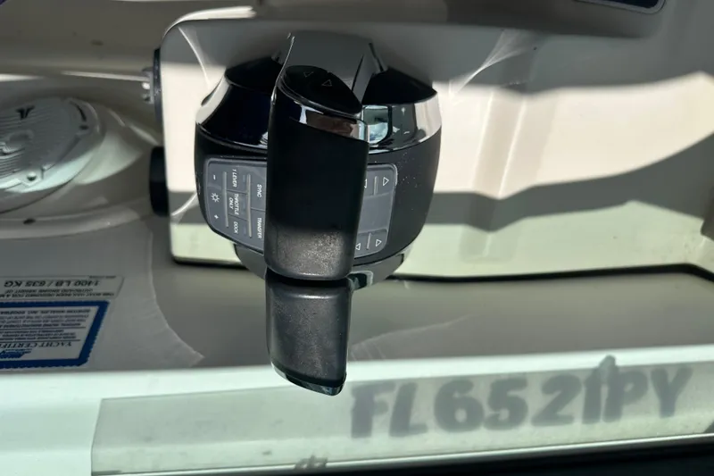 Slide: The Image of Throttle control of a 2015 Boston Whaler 270 Vantage boat, showing detailed buttons and levers. - 22