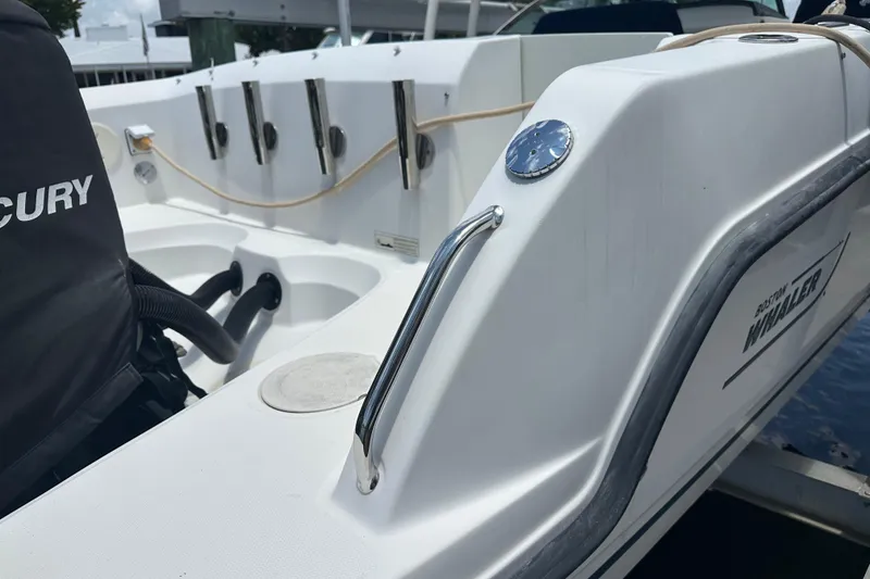 Slide: The Image of 2015 Boston Whaler 270 Vantage boat interior with Mercury engine detail. - 36