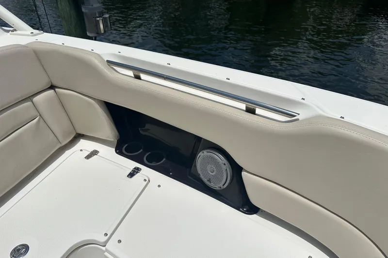 Slide: The Image of Interior view of a 2015 Boston Whaler 270 Vantage boat with cushioned seating. - 29