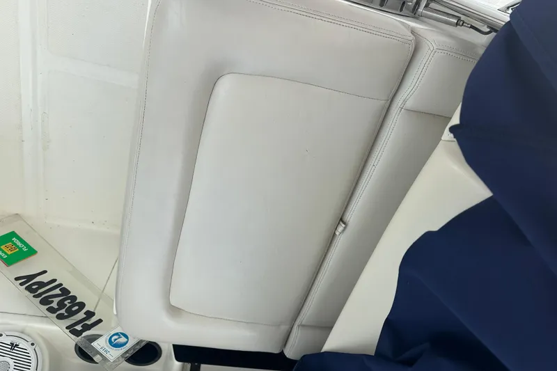 Slide: The Image of Interior of a 2015 Boston Whaler 270 Vantage boat with white seating. - 19