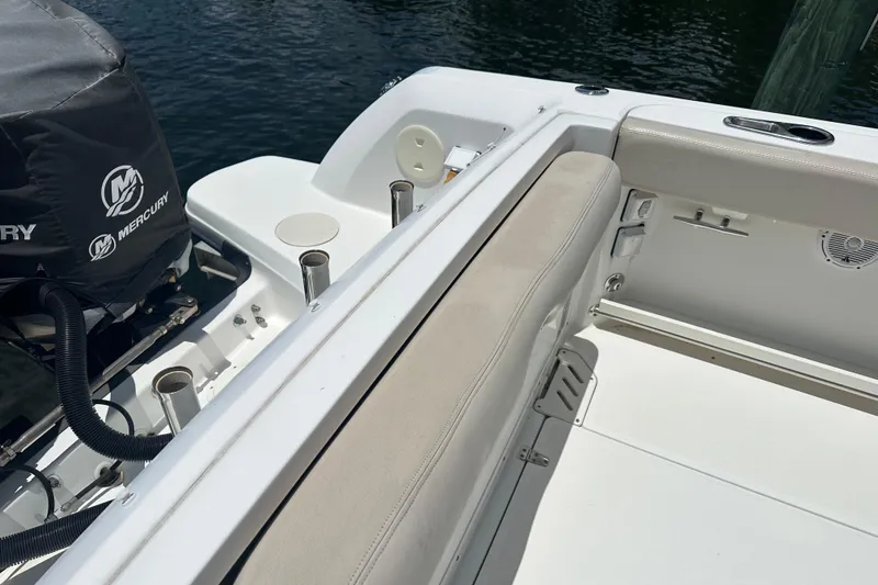 Slide: The Image of 2015 Boston Whaler 270 Vantage boat interior with Mercury engine cover. - 15