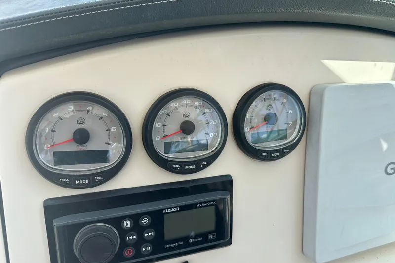 Slide: The Image of Dashboard of a 2015 Boston Whaler 270 Vantage with gauges and controls. - 25