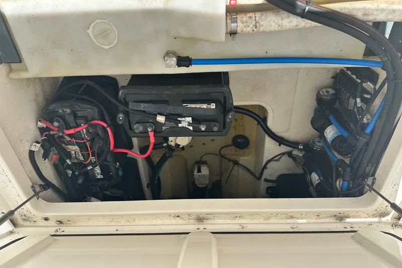 Slide: The Image of Engine compartment of a 2015 Boston Whaler 270 Vantage, showing wiring and components. - 17