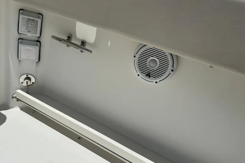 Slide: The Image of Interior view of a 2015 Boston Whaler 270 Vantage boat, featuring a speaker and cleat. - 18