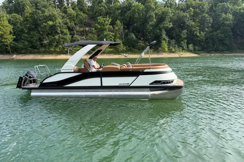 The Image of 2026 Harris Grand Mariner 230 SLDH pontoon boat on a serene lake. - 1