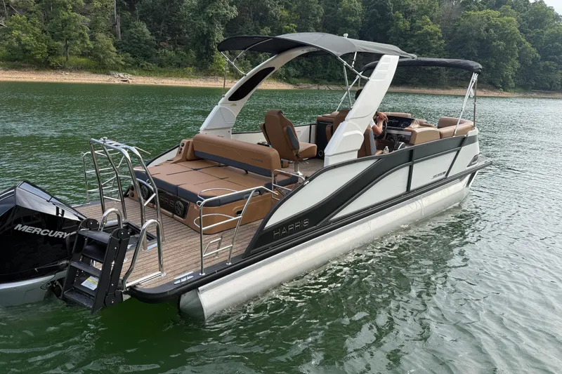 Slide: The Image of 2026 Harris Grand Mariner 230 SLDH pontoon boat on a serene lake. - 5