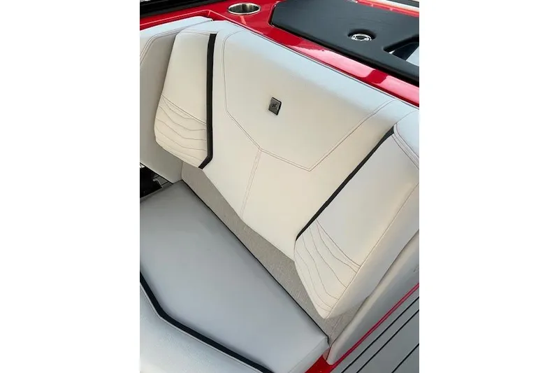 Slide: The Image of 2025 Nautique Super Air Nautique G23 interior seat detail with red and white upholstery. - 10