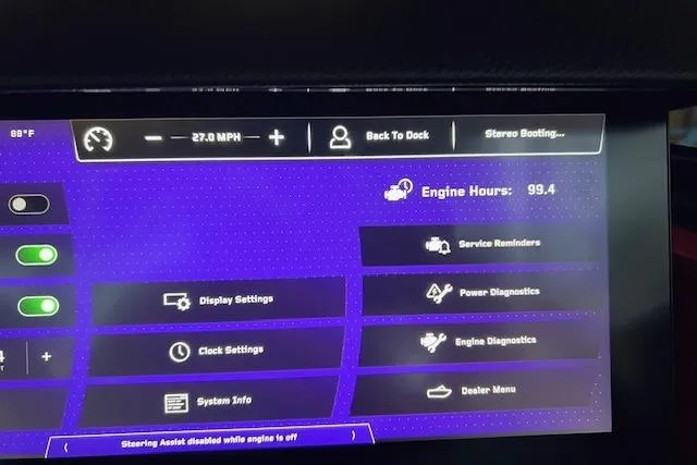 Slide: The Image of Dashboard display of a 2025 Nautique Super Air Nautique G23 showing engine hours and settings. - 9