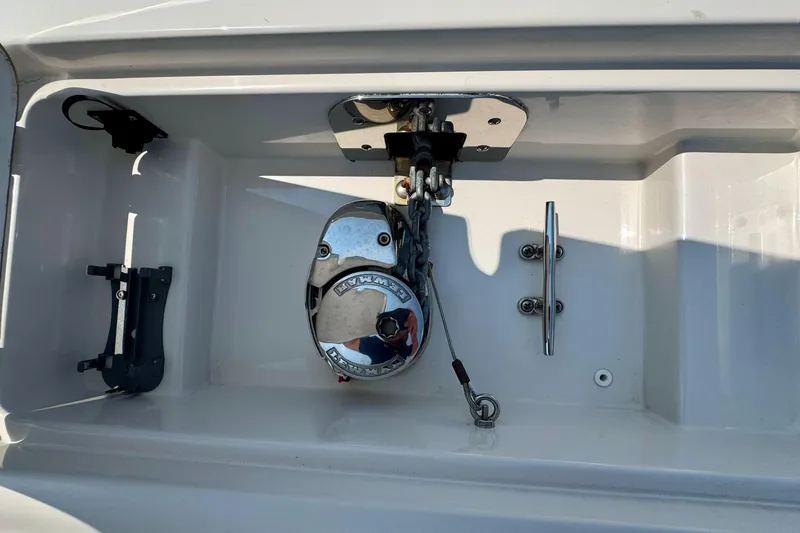 Slide: The Image of Anchor compartment of 2017 Sailfish 290 CC boat with winch and cleat. - 31