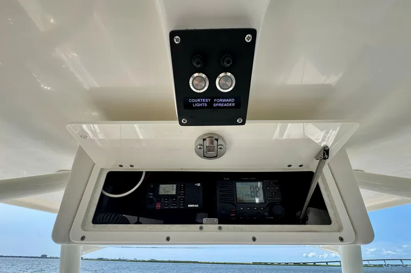 Slide: The Image of 2017 Sailfish 290 CC boat console with control panel and marine electronics. - 14