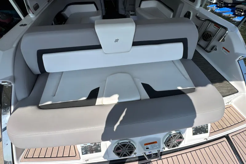 Slide: The Image of 2017 Four Winns H290 boat interior with cushioned seating and modern design. - 32