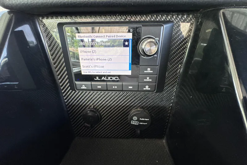 Slide: The Image of Dashboard of a 2017 Four Winns H290 boat with JL Audio Bluetooth interface. - 44