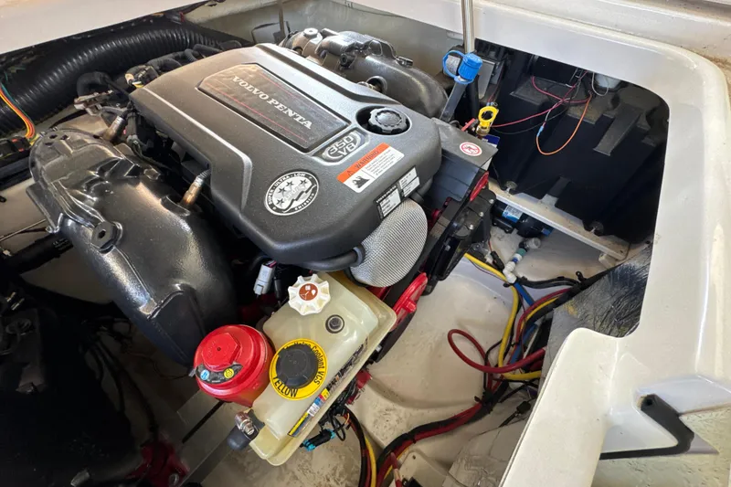 Slide: The Image of Volvo Penta engine in 2017 Four Winns H290 boat, showcasing detailed components and wiring. - 38