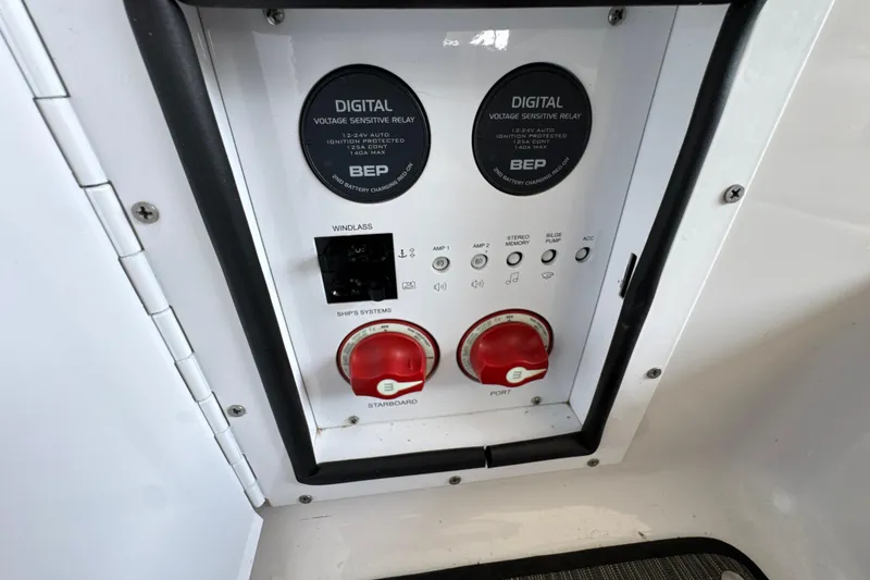 Slide: The Image of Control panel of a 2017 Four Winns H290 boat with digital voltage sensitive relay. - 56