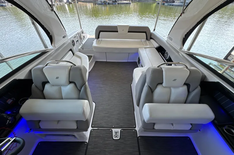 Slide: The Image of Interior of 2017 Four Winns H290 boat with luxurious seating and lake view. - 14