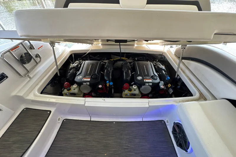 Slide: The Image of 2017 Four Winns H290 boat engine compartment with dual engines visible. - 36