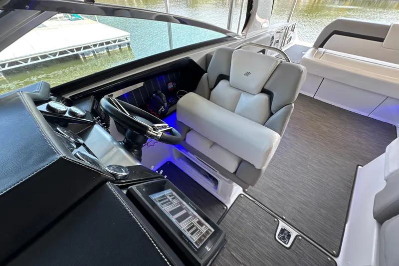 Slide: The Image of Interior of 2017 Four Winns H290 boat with modern helm and seating. - 6