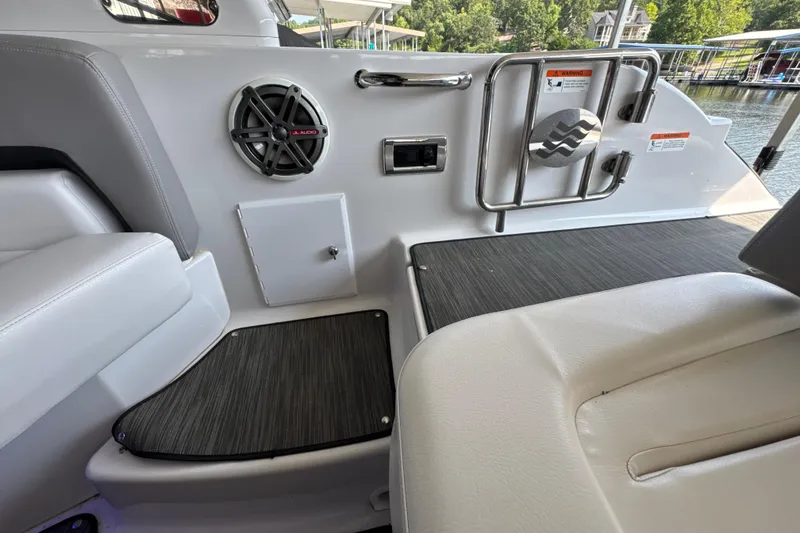 Slide: The Image of Interior of 2017 Four Winns H290 boat with speaker and seating area. - 50
