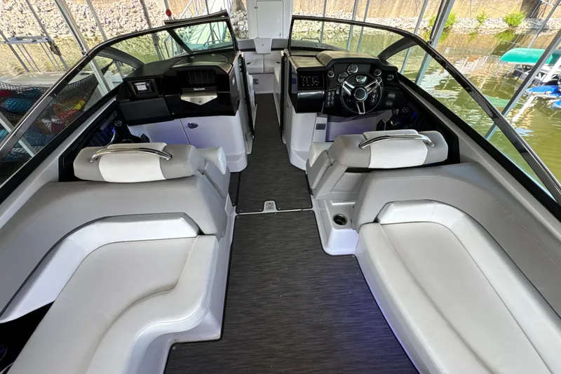 Slide: The Image of Interior of 2017 Four Winns H290 boat with sleek seating and modern dashboard design. - 16