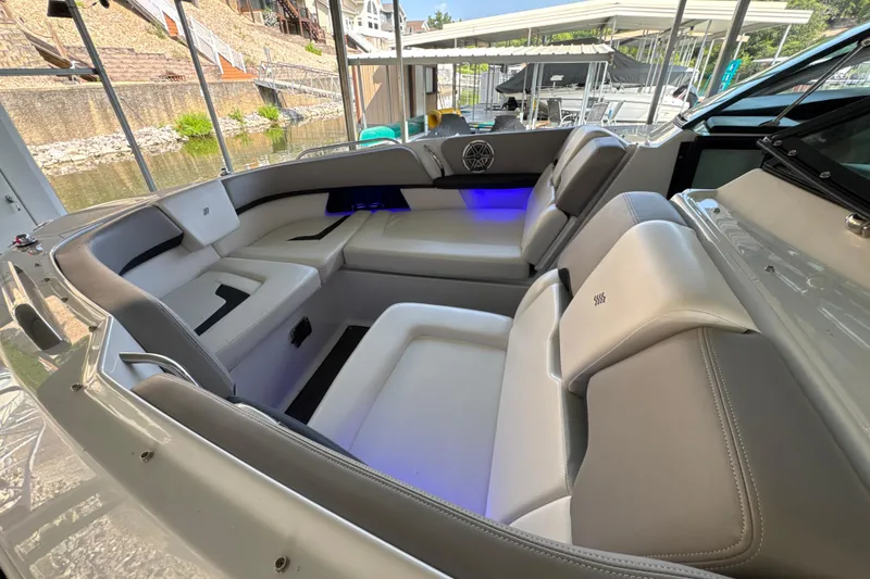 Slide: The Image of Luxurious seating area on a 2017 Four Winns H290 boat, featuring elegant upholstery and ambient lighting. - 19