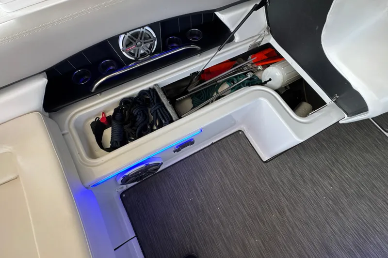 Slide: The Image of 2017 Four Winns H290 boat storage compartment with ropes and equipment. - 27