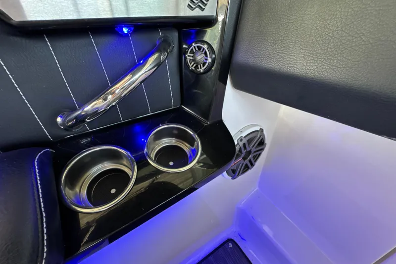 Slide: The Image of Interior of 2017 Four Winns H290 boat with cup holders and blue LED lighting. - 54