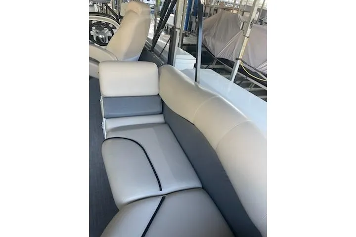 Slide: The Image of 2023 PlayCraft 27 Infinity boat interior with luxurious seating and modern design. - 9