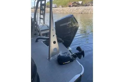 Slide: The Image of 2023 PlayCraft 27 Infinity boat with Mercury engine on calm water. - 4