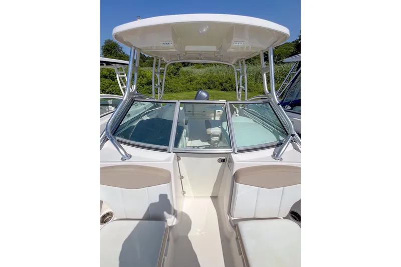 Slide: The Image of 2019 Robalo R247 Dual Console boat with sleek design and spacious seating. - 16