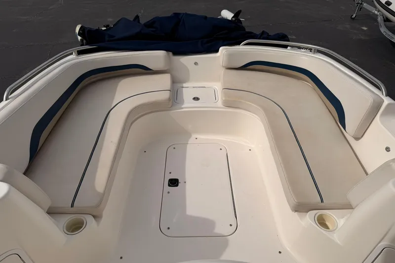 Slide: The Image of 2006 Hurricane FunDeck GS 211 OB boat interior with spacious seating and cup holders. - 14