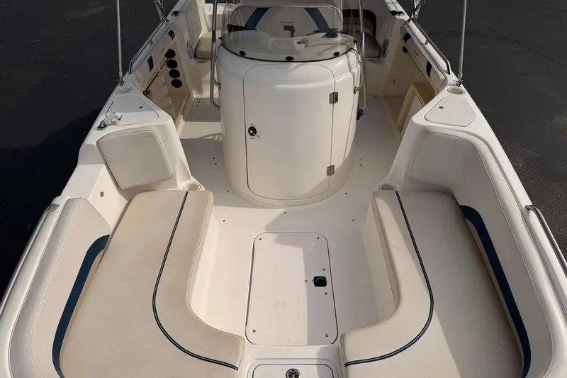 Slide: The Image of 2006 Hurricane FunDeck GS 211 OB boat interior with spacious seating and storage compartments. - 15