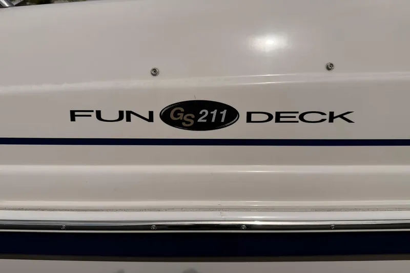 Slide: The Image of 2006 Hurricane FunDeck GS 211 OB boat logo on white surface. - 27