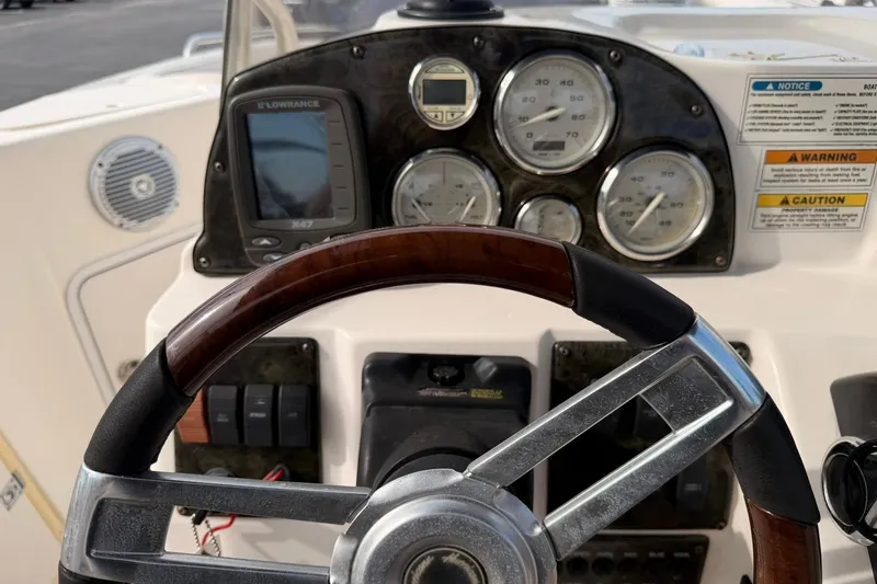 Slide: The Image of Steering console of a 2006 Hurricane FunDeck GS 211 OB boat with gauges and controls. - 20