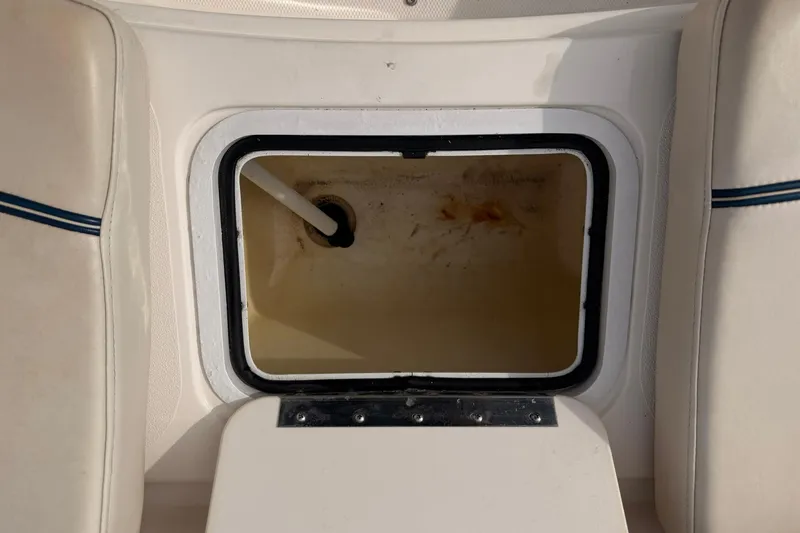 Slide: The Image of Open storage compartment on a 2006 Hurricane FunDeck GS 211 OB boat. - 19