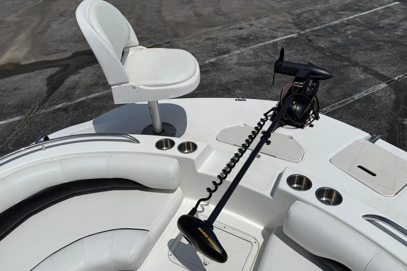 Slide: The Image of 2014 Hurricane SunDeck Sport 188 OB boat interior with seating and trolling motor. - 12
