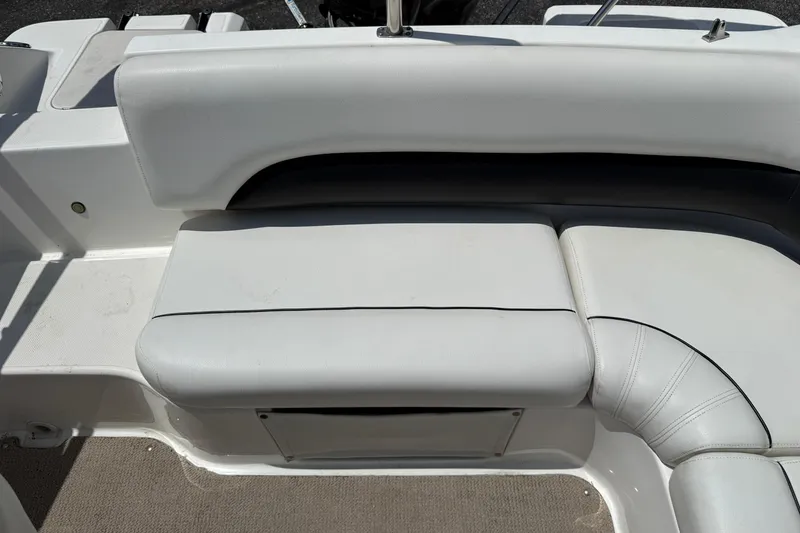 Slide: The Image of 2014 Hurricane SunDeck Sport 188 OB boat seating, featuring white cushioned upholstery. - 17
