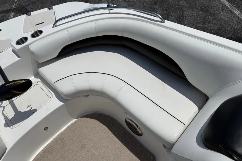 Slide: The Image of 2014 Hurricane SunDeck Sport 188 OB boat interior with white cushioned seating. - 13