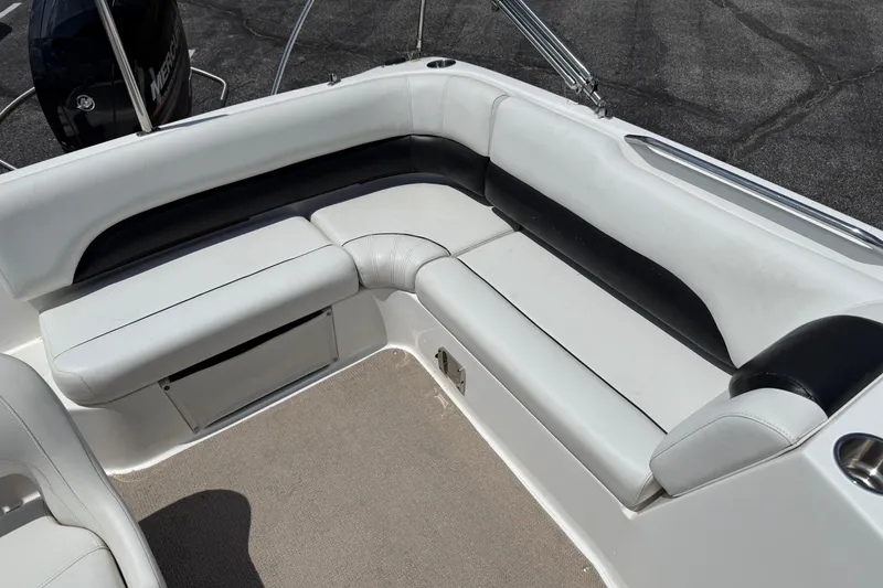 Slide: The Image of 2014 Hurricane SunDeck Sport 188 OB boat interior with white and black seating. - 16