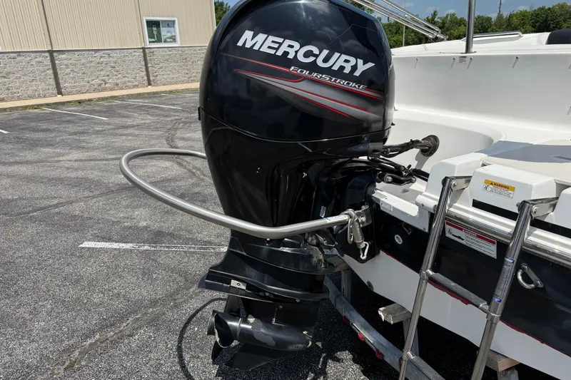 Slide: The Image of 2014 Hurricane SunDeck Sport 188 OB with Mercury FourStroke outboard engine in a parking lot. - 6
