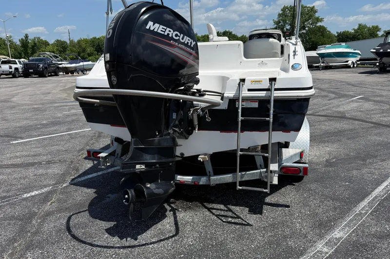 Slide: The Image of 2014 Hurricane SunDeck Sport 188 OB boat with Mercury outboard motor in parking lot. - 30