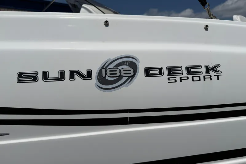 Slide: The Image of 2014 Hurricane SunDeck Sport 188 OB boat logo on white hull. - 31