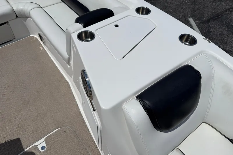 Slide: The Image of 2014 Hurricane SunDeck Sport 188 OB boat interior with cup holders and cushioned seating. - 19