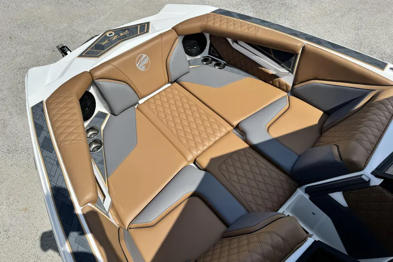Slide: The Image of Luxurious interior of 2025 Tigé 24RZX boat with tan and gray seating. - 16