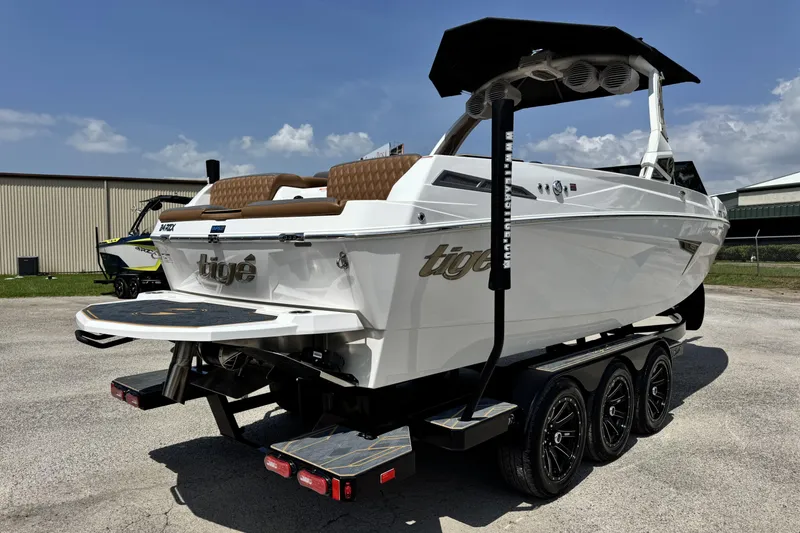 Slide: The Image of 2025 Tigé 24RZX boat on trailer, featuring sleek design and modern amenities. - 5
