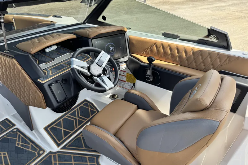 Slide: The Image of 2025 Tigé 24RZX boat interior with luxurious leather seating and modern dashboard design. - 12