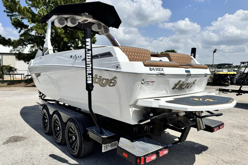Slide: The Image of 2025 Tigé 24RZX boat on trailer, featuring sleek design and modern amenities. - 8