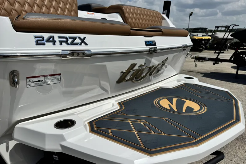 Slide: The Image of 2025 Tigé 24RZX boat with luxurious seating and stylish deck design. - 10