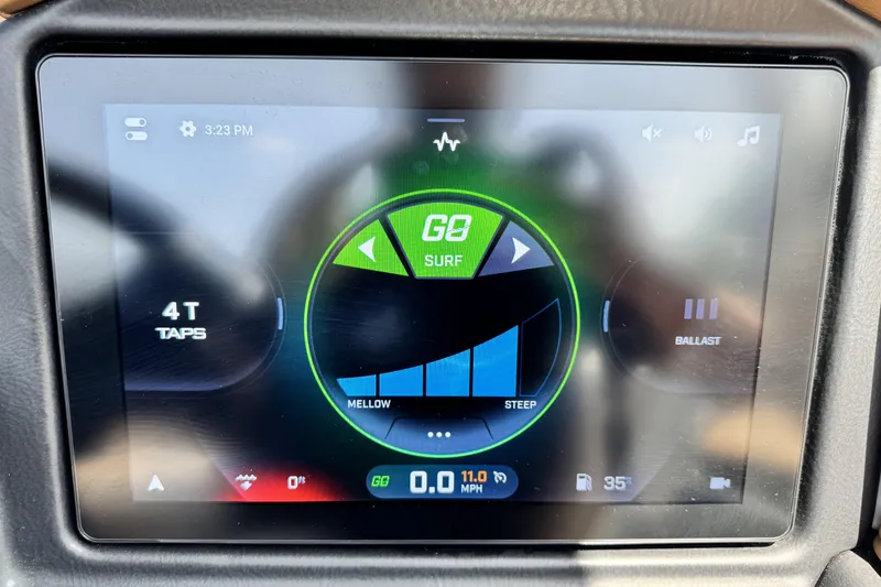 Slide: The Image of Touchscreen display of a 2025 Tigé 24RZX boat showing surf settings and controls. - 14