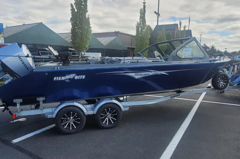 Slide: The Image of 2023 Fish Rite 210 Performer boat on trailer in parking lot. - 5